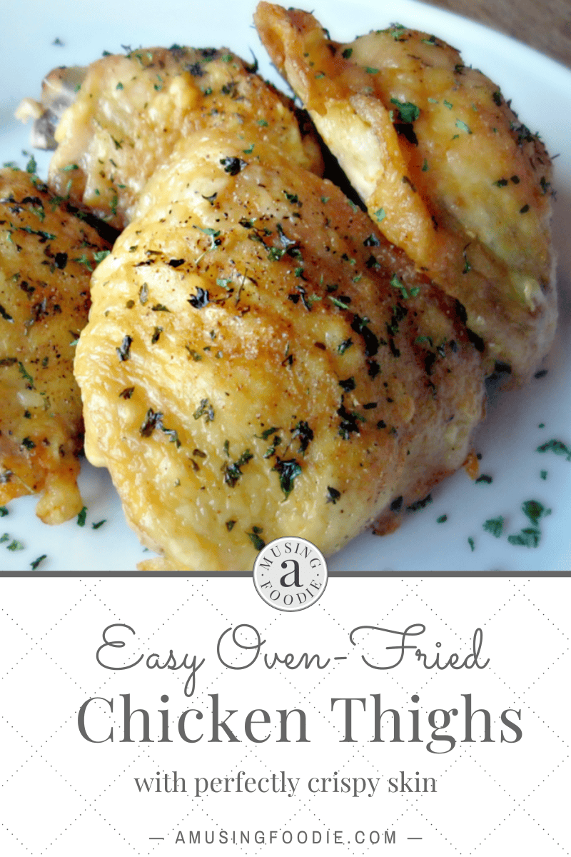 Oven-fried chicken thighs sprinkled with parsley.