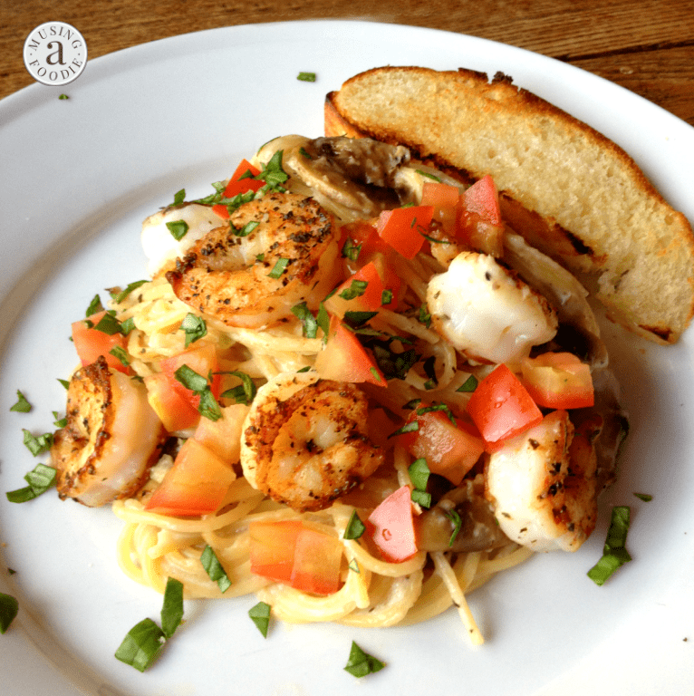 Seared salt and pepper shrimp over thin spaghetti with a mushroom and garlic cream sauce sounds like a fancy dinner, but it's actually super easy!