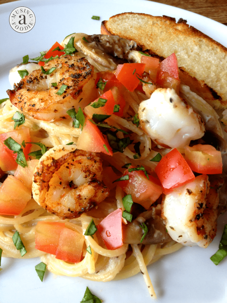 Seared salt and pepper shrimp over thin spaghetti with a mushroom and garlic cream sauce sounds like a fancy dinner, but it's actually super easy!