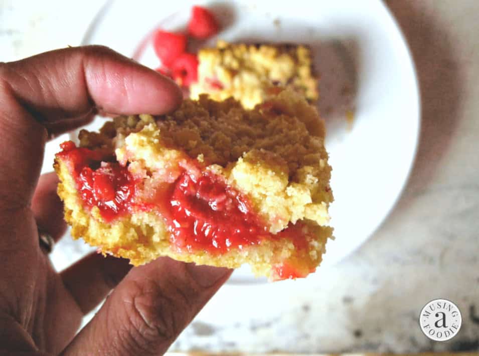 These raspberry crumble bars are perfect with coffee or tea for a quick breakfast—and they make for a lovely late night treat, too!