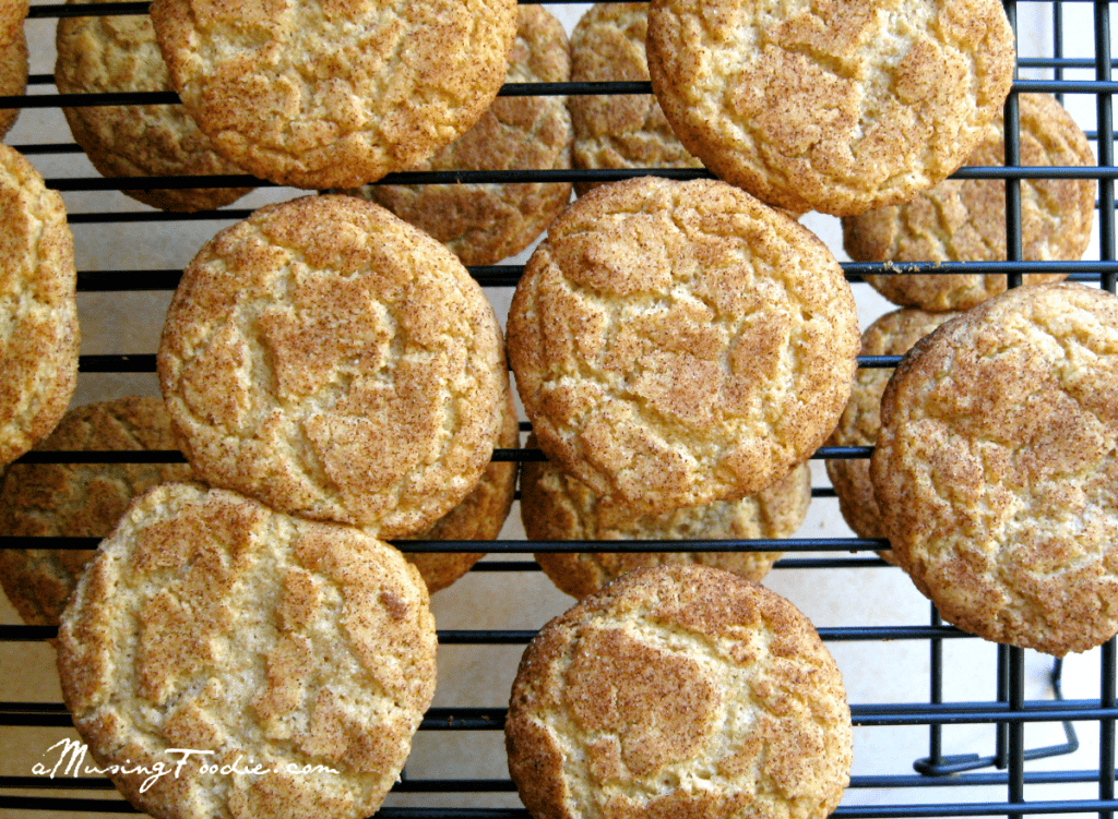 Snickerdoodles cookies on a cooling rack.