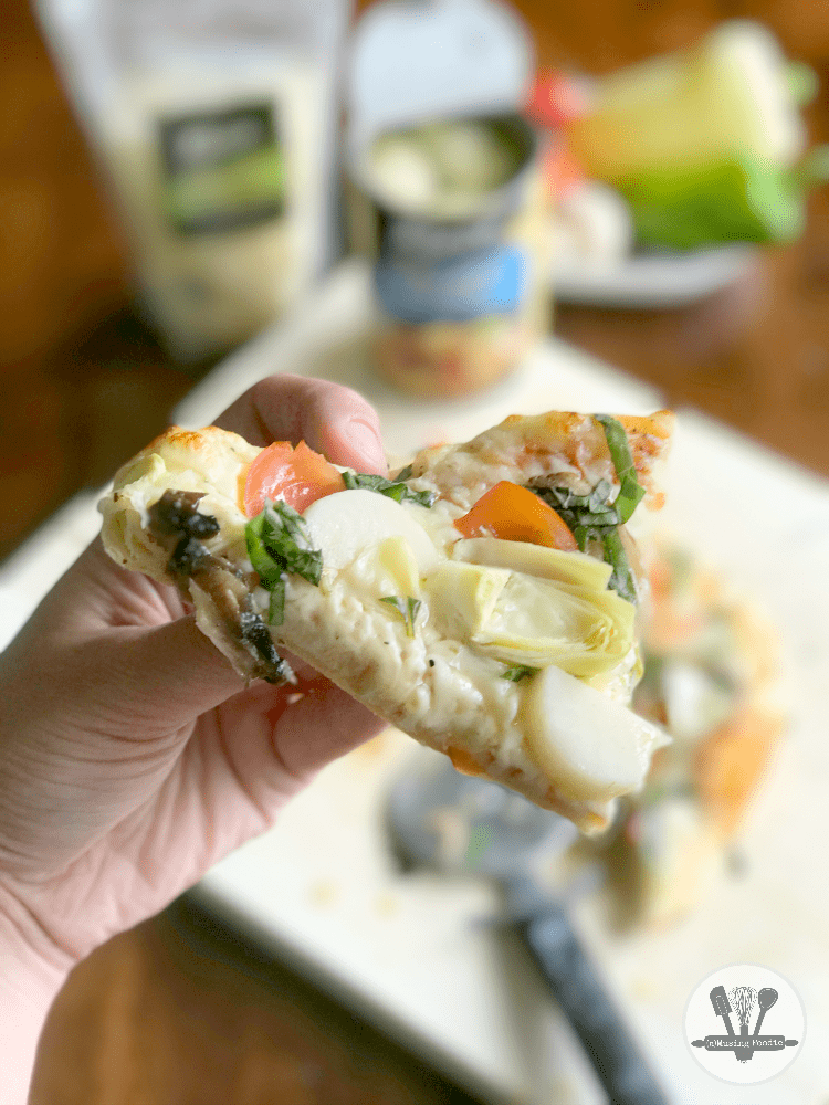 This rustic homemade pizza, loaded with yummy veggies like hearts of palm, sweet peppers, tender small artichoke hearts, fresh tomatoes, is the perfect dinner for summer!