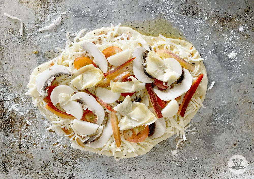 This rustic homemade pizza, loaded with yummy veggies like hearts of palm, sweet peppers, tender small artichoke hearts, fresh tomatoes, is the perfect dinner for summer!