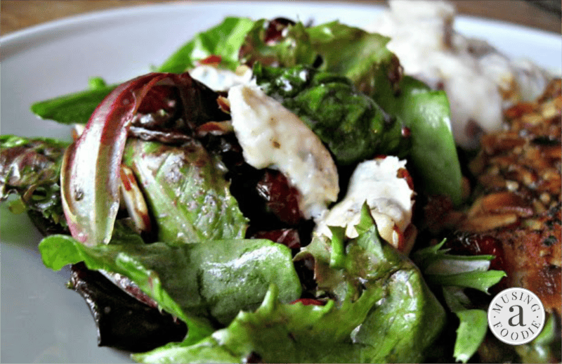 This simple field green salad, dressed with a Dijon balsamic and loaded with creamy Gorgonzola, tart cranberries and crunchy sliced almonds, makes for a perfect side salad or main course meal!