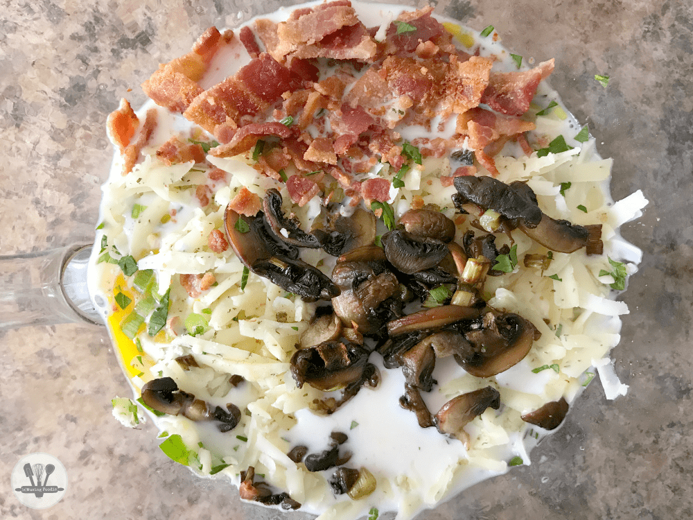 This savory crustless quiche for two is perfect for brunch (or dinner)! It's simply made, with Nellie's® Free Range Eggs, two kinds of cheddar from the Cabot® Creamery co-op of Vermont farm families, bacon, parsley and an assortment of veggies—including organic mushrooms, green onions and ripe heirloom tomatoes from the garden (or from your local farmers' market).