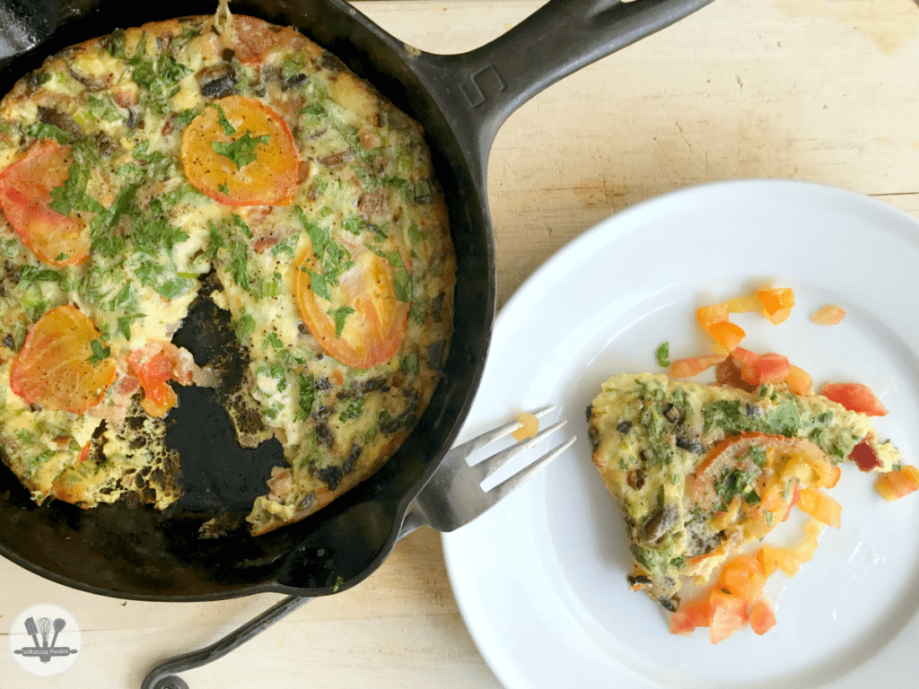 This savory crustless quiche for two is perfect for brunch (or dinner)! It's simply made, with Nellie's® Free Range Eggs, two kinds of cheddar from the Cabot® Creamery co-op of Vermont farm families, bacon, parsley and an assortment of veggies—including organic mushrooms, green onions and ripe heirloom tomatoes from the garden (or from your local farmers' market).