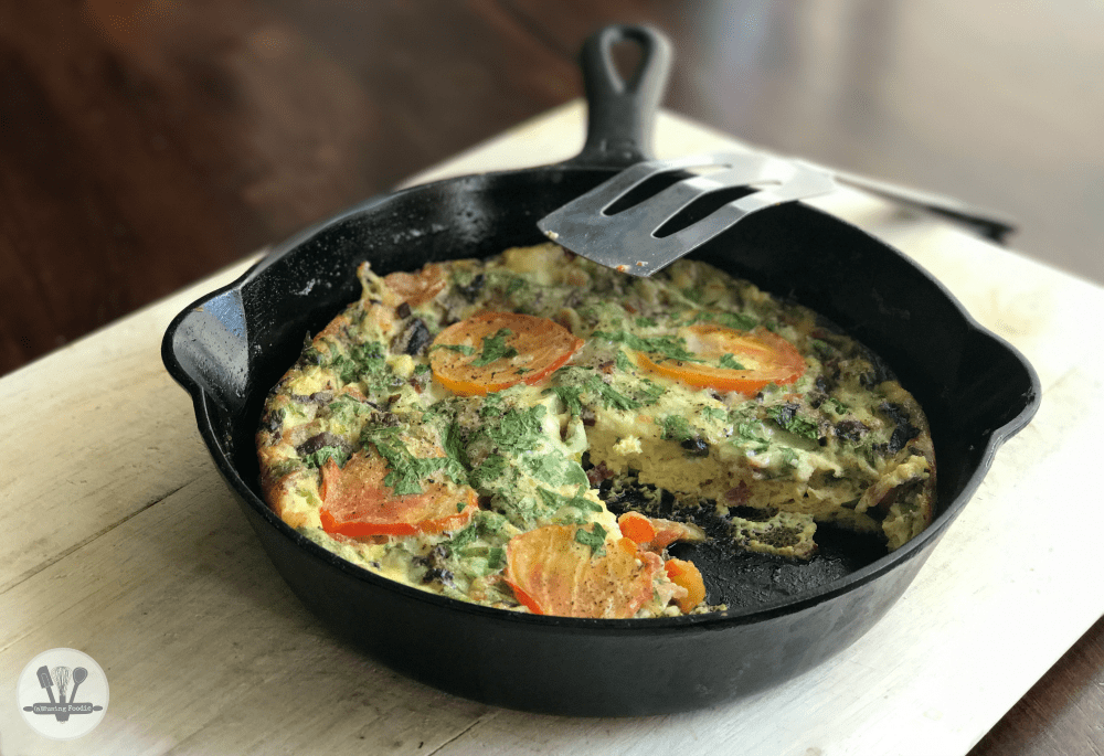 This savory crustless quiche for two is perfect for brunch (or dinner)! It's simply made, with Nellie's® Free Range Eggs, two kinds of cheddar from the Cabot® Creamery co-op of Vermont farm families, bacon, parsley and an assortment of veggies—including organic mushrooms, green onions and ripe heirloom tomatoes from the garden (or from your local farmers' market).