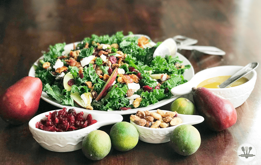 This fall kale salad is topped with Sahale Snacks Honey Almonds Glazed Mix, full of dried cranberries, sliced red pears, crispy bacon, honey goat cheese and a hint of lime juice. A simple homemade honey mustard dressing drizzled on top adds a final sweet and savory note. Yum!