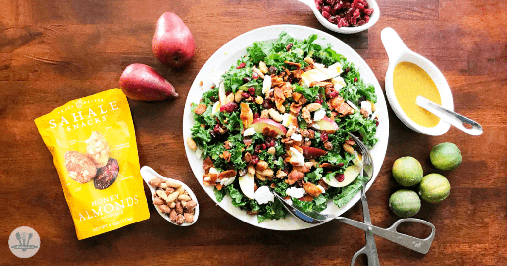 This fall kale salad is topped with Sahale Snacks Honey Almonds Glazed Mix, full of dried cranberries, sliced red pears, crispy bacon, honey goat cheese and a hint of lime juice. A simple homemade honey mustard dressing drizzled on top adds a final sweet and savory note. Yum!