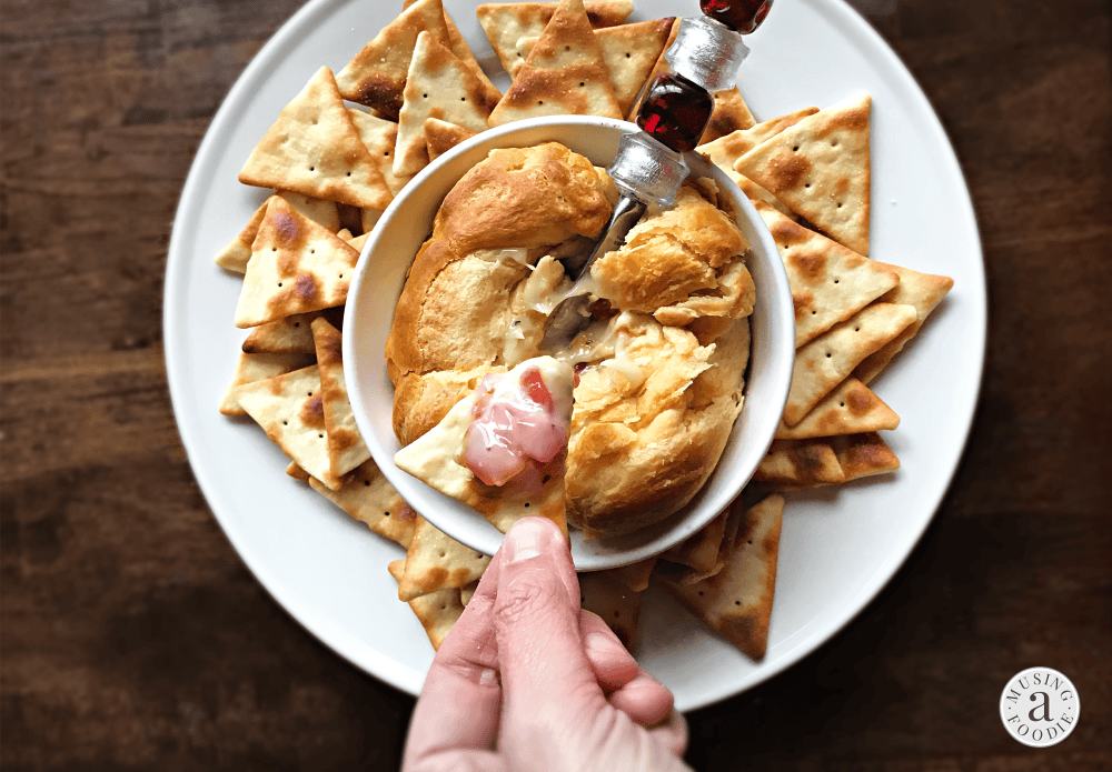 This mouth-watering ooey-gooey baked brie with RO*TEL is a fun and festive appetizer that's perfect for holidays and entertaining!