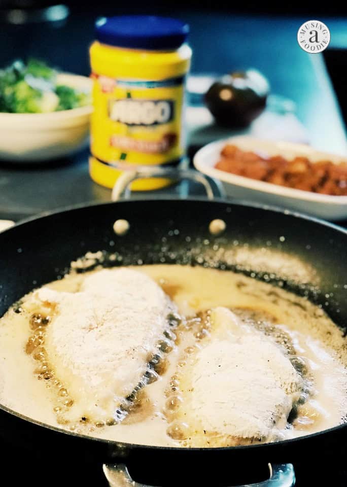 Thinly sliced chicken breasts dredged in a corn starch and flour mix, then seared in bacon grease on the stove.